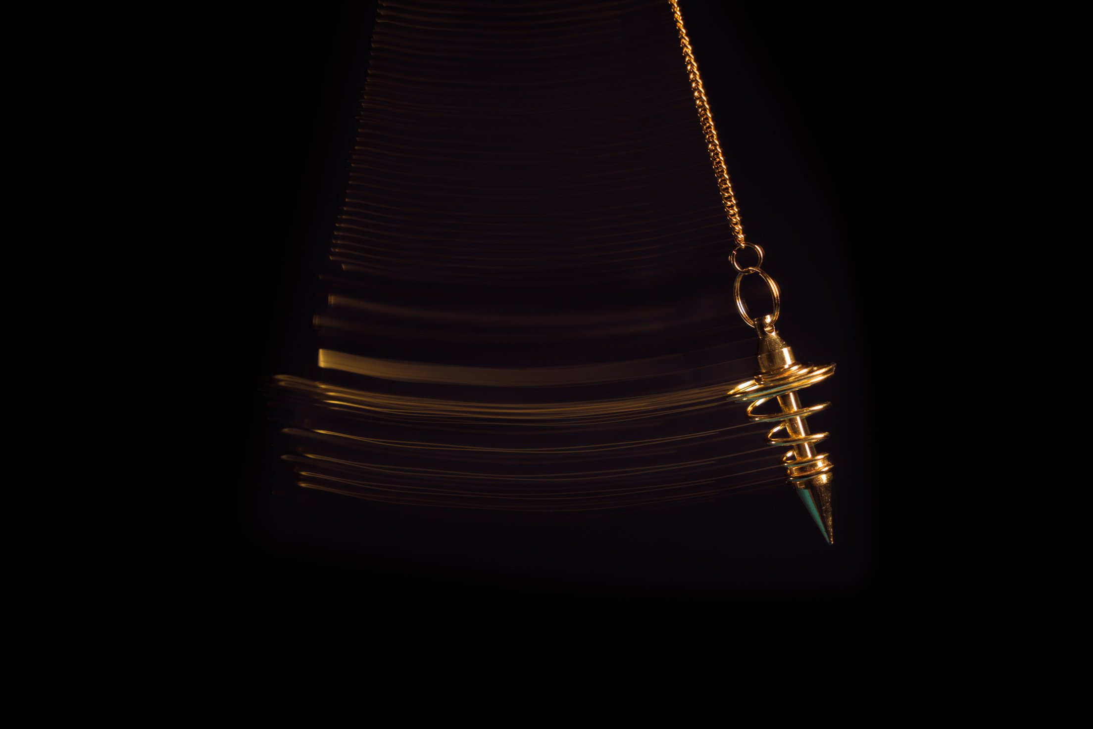Hypnotism pendulum swinging with motion blur